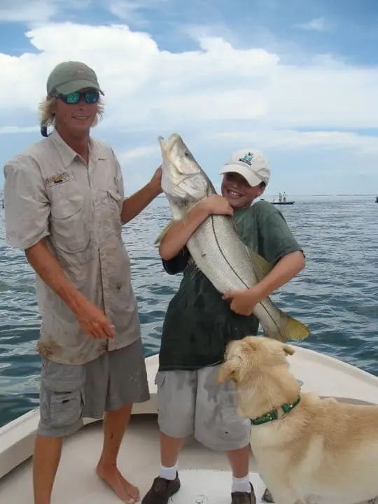 Big fish & happy child, Sanibel & Captiva Islands fishing.