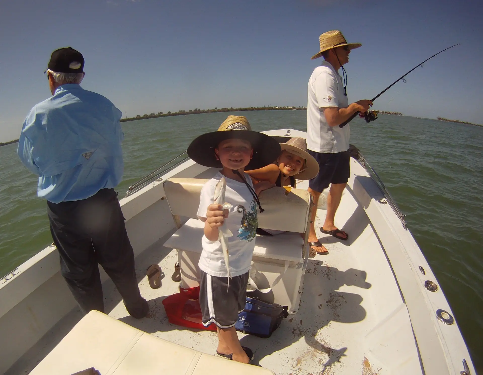 Tough Young Angler "Wrastling" A Ladyfish; Sanibel & Captiva Fishing Charters.
