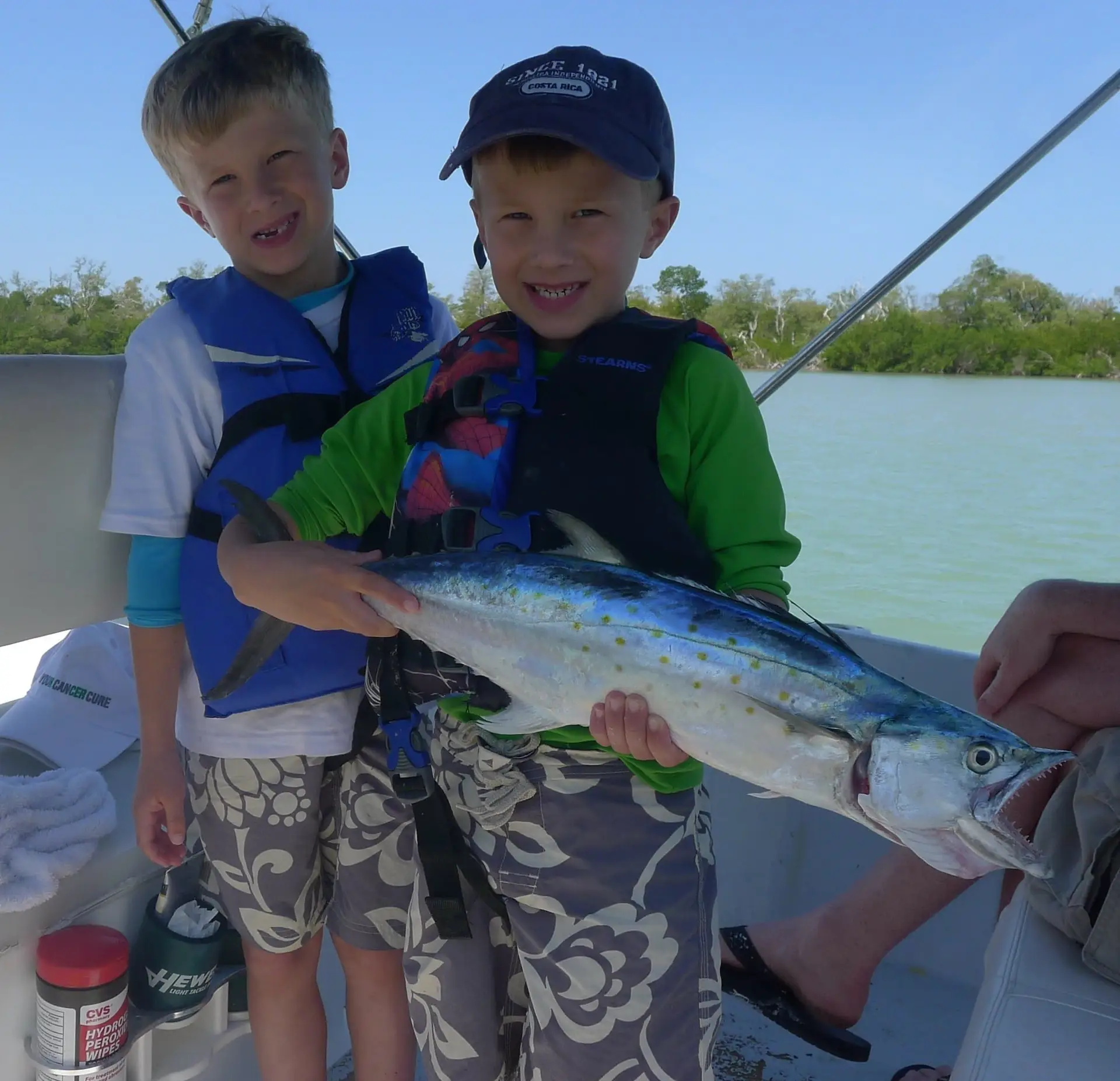 A huge Spanish Mackerel and two happy kids on Sanibel & Captiva charters!