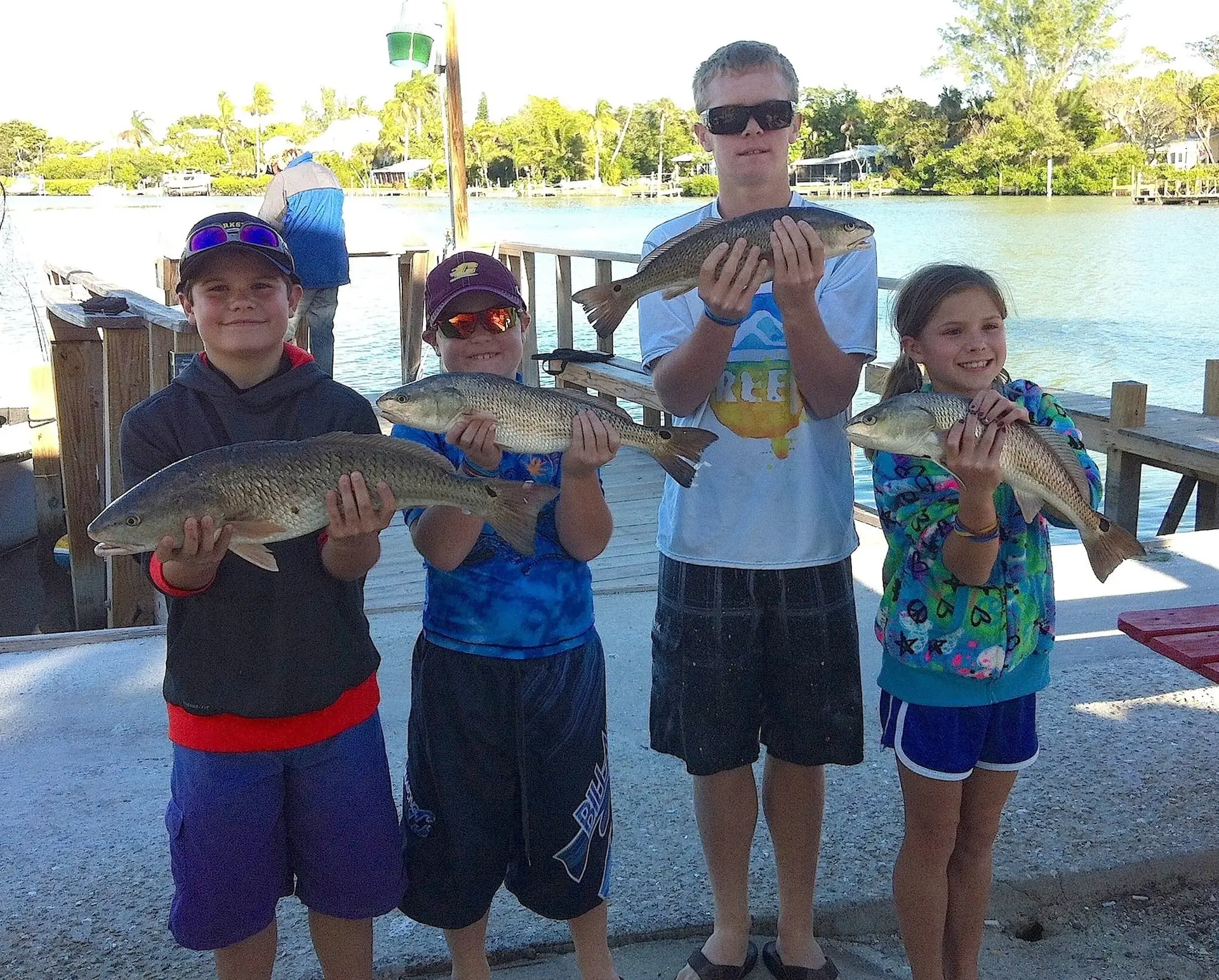 Four Children & Redfish, Sanibel & Captiva Islands Charters & Fishing Guide Service.