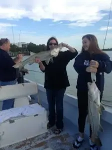 Two nice girls with two nice Snook on Sanibel & Captiva charters