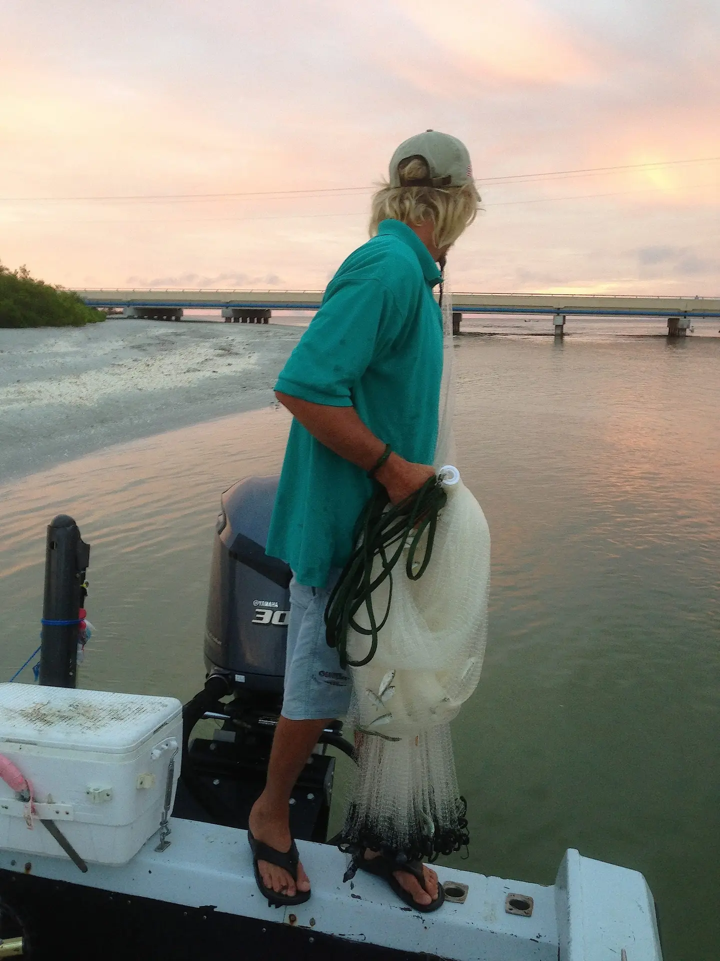 Throwing the castnet, Blind Pass, Sanibel & Captiva Islands & Fort Myers Charters & Fishing Guide Service. Thursday, May 4, 2017.