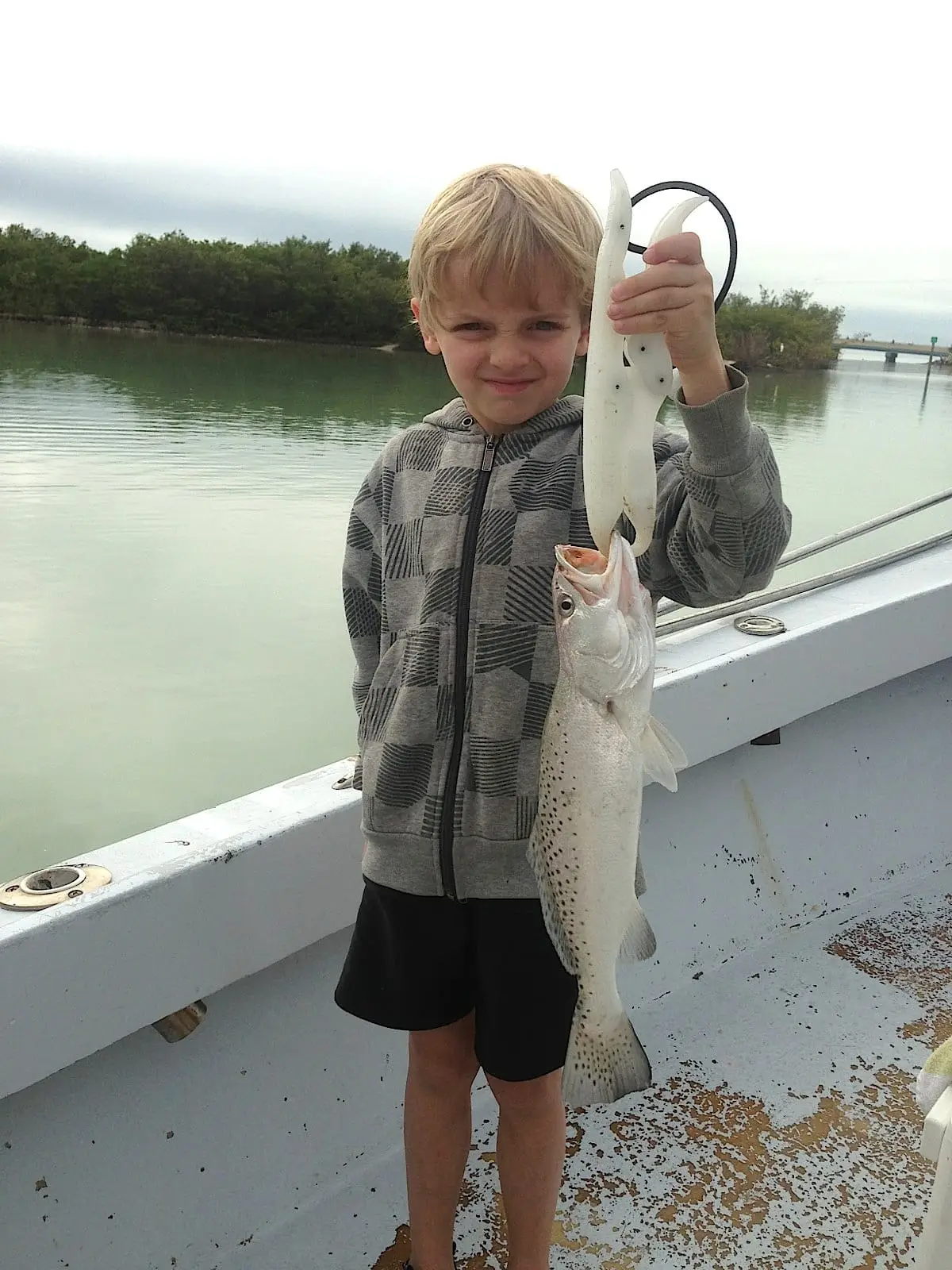 Little boy with a Sea Trout caught in Blind Pass on Sanibel & Captiva charters