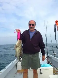 Nick with a Grouper caught offshore of Captiva on Sanibel & Captiva charters!