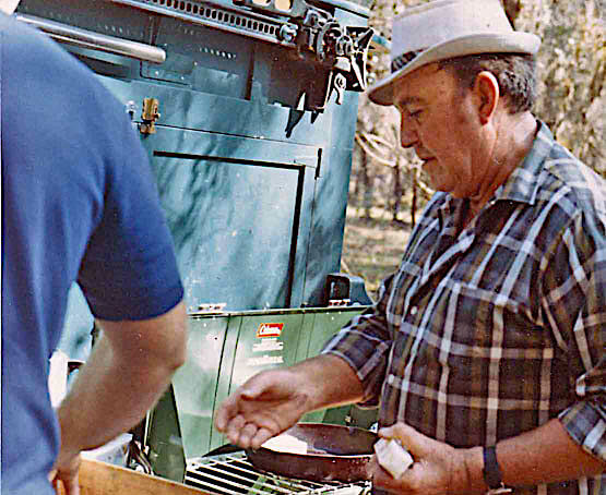 Fingers O'Bannon & Ogden Phipps, Quail Hunting, Clewiston Florida, January 1970. "Fingers mans the grill and cooks up a delicious lunch." Source: New York Social Diary.